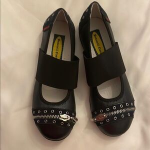 BOUTACCELLI CLASSICS black zippered front, stud design w/studs also on back heel